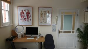 Chiropractic massage room office desk